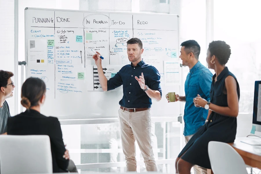 Man defining marketing plan to team members