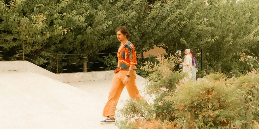 Man in Orange Pants Walking Walkway