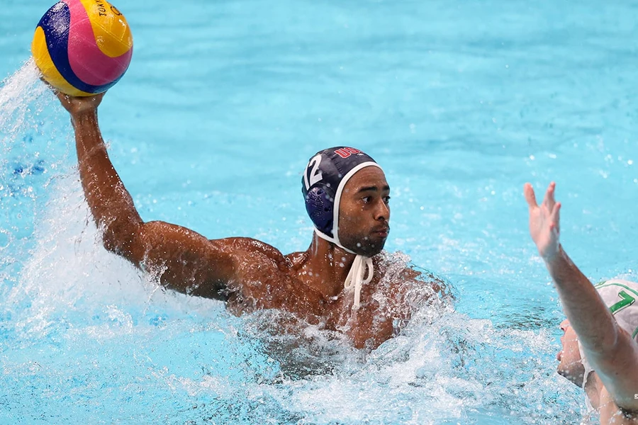 Man in black water polo cap