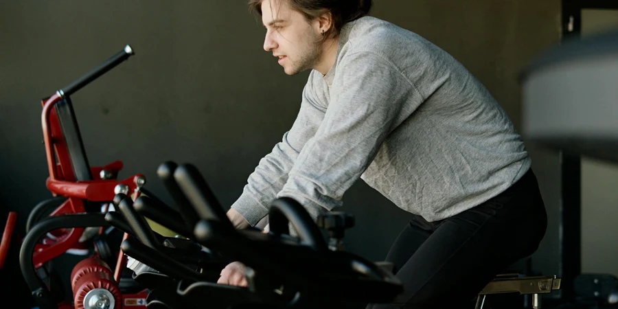 Man on an Exercise Bike at the Gym