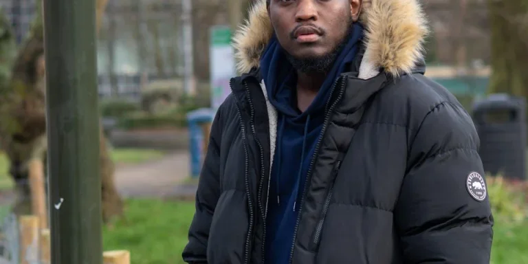 Man posing in a black winter jacket