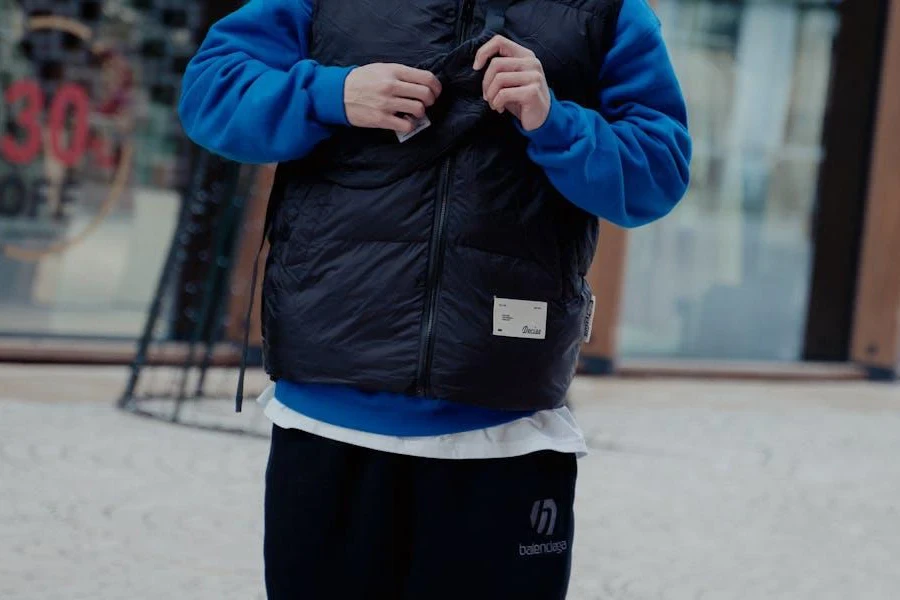 Man rocking a down vest over a long-sleeved shirt