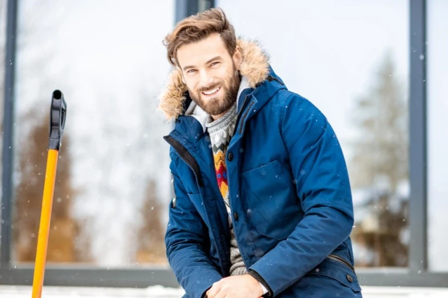 Man sitting on the terrace of the modern house during the winter