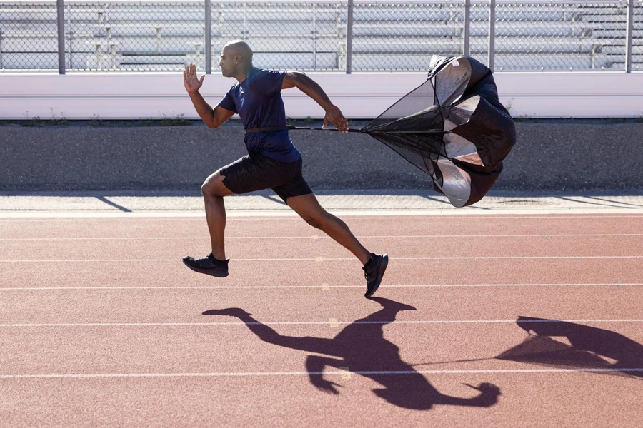 Man sprinting with a speed chute