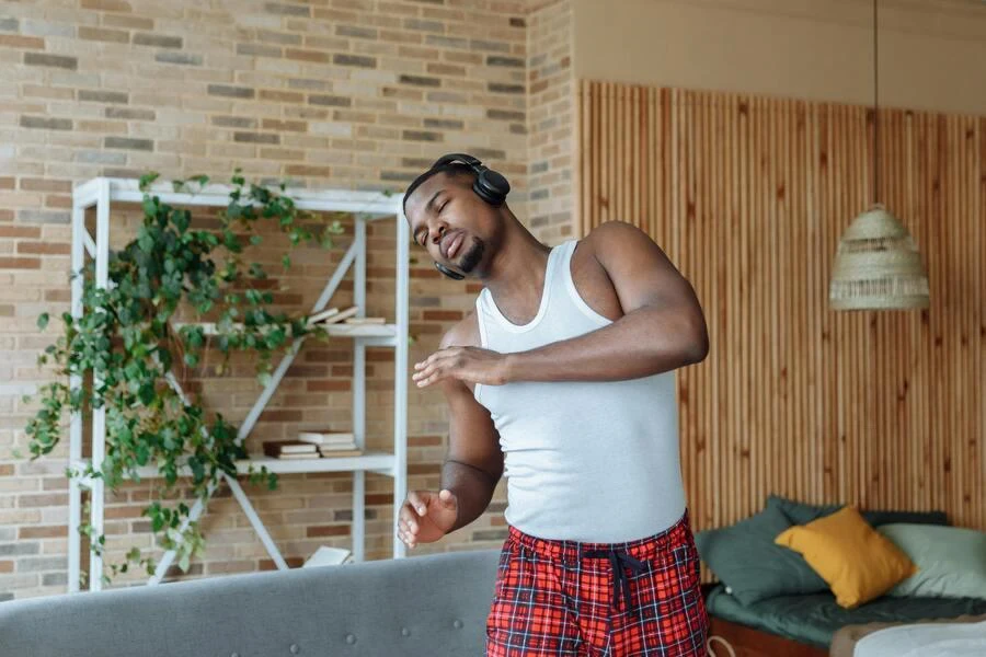 Man stretching in a regular-fit tank top