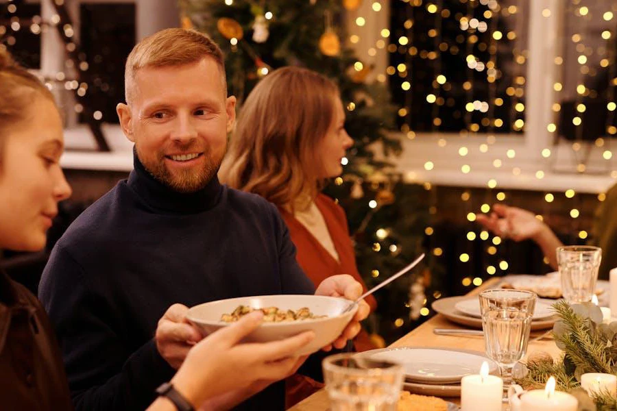Man wearing a turtleneck sweater at a Christmas dinner