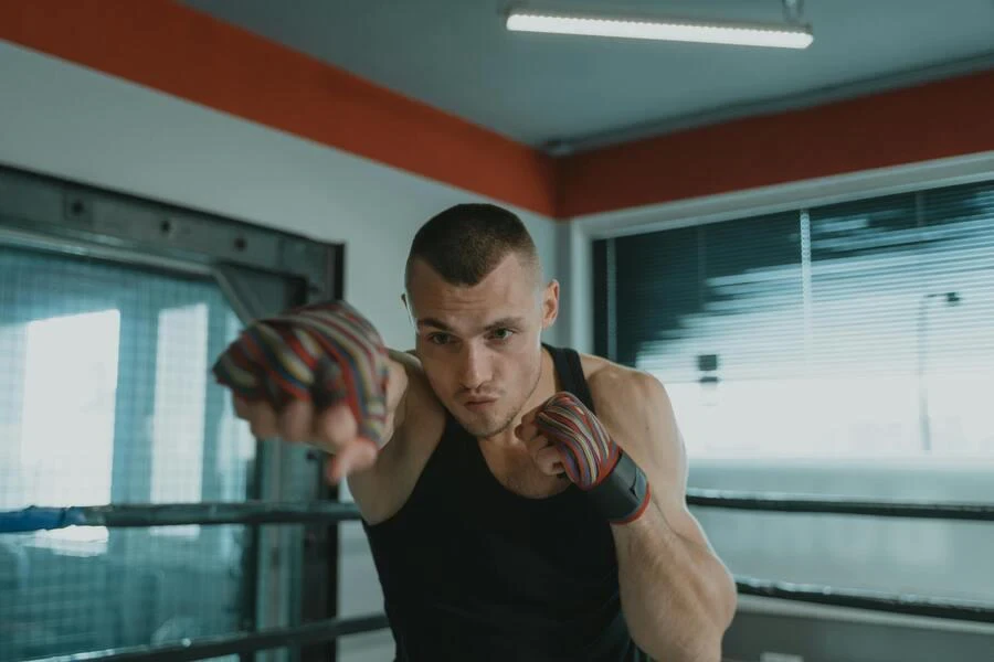 Man working out in a black tank top