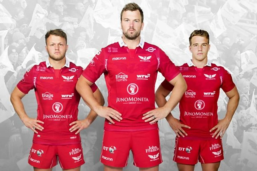 Men in rugby uniforms with up to eight sponsorships