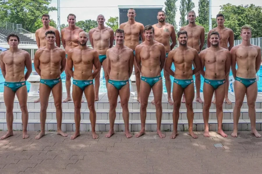 Men posing in water polo swimming briefs
