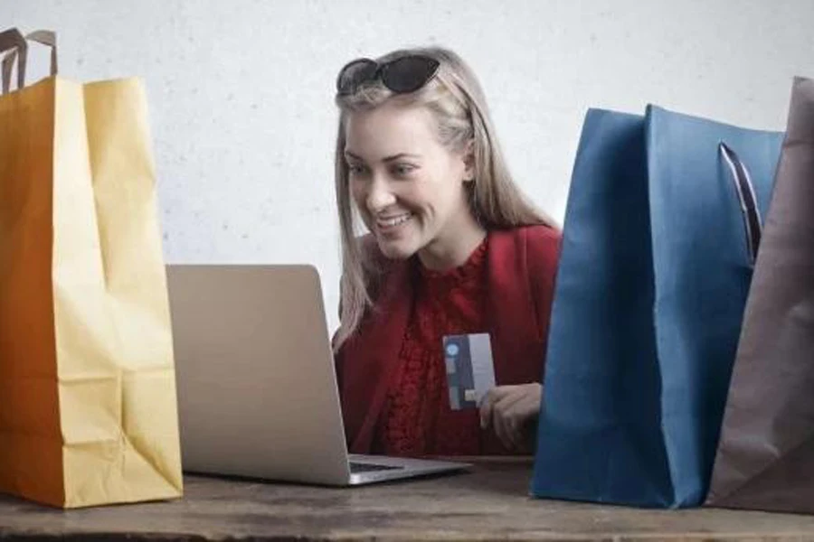 Millennial shopping online on her laptop