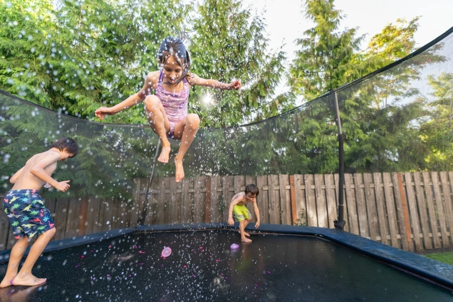 Mixed Race Siblings Playing Outside On A Warm Summer Day 