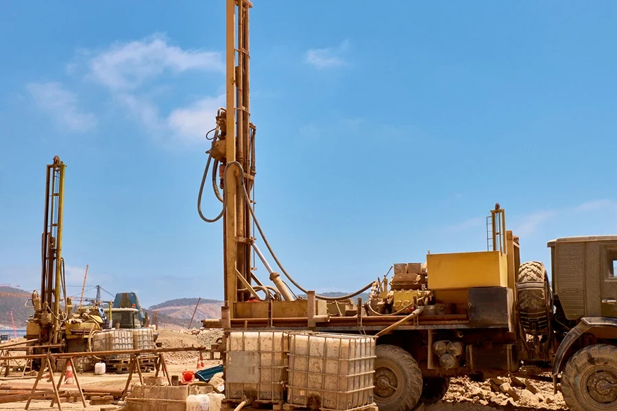 Mobile drilling rigs on vehicles at construction site