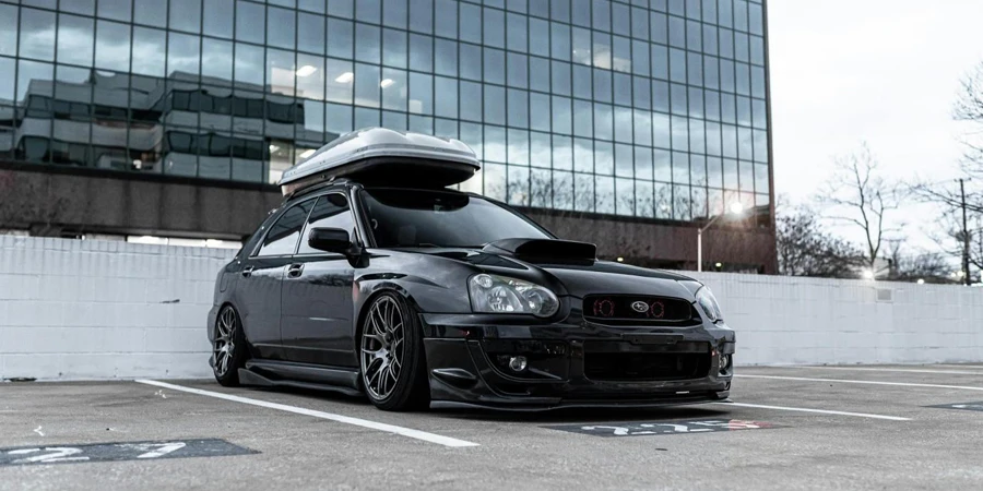 Modern sport car with rack on top parked on pavement