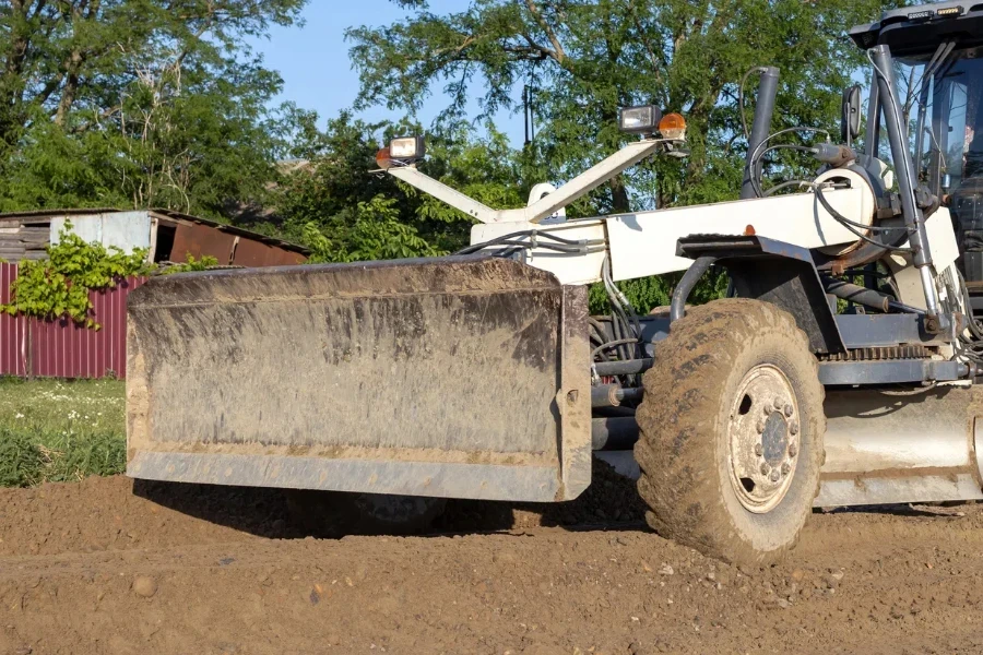 Motor grader on road construction