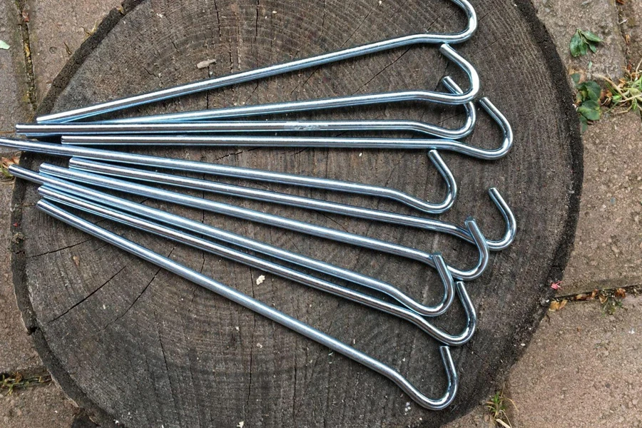 Multiple long tent pegs with hooks