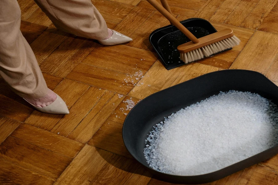 Person Cleaning a Wooden Flooring