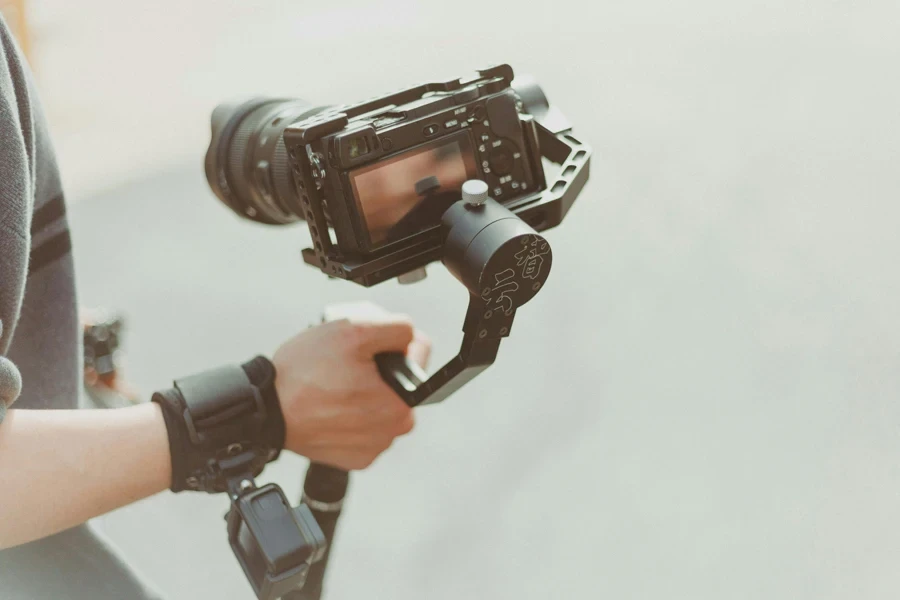 Person Holding Black Dslr Camera