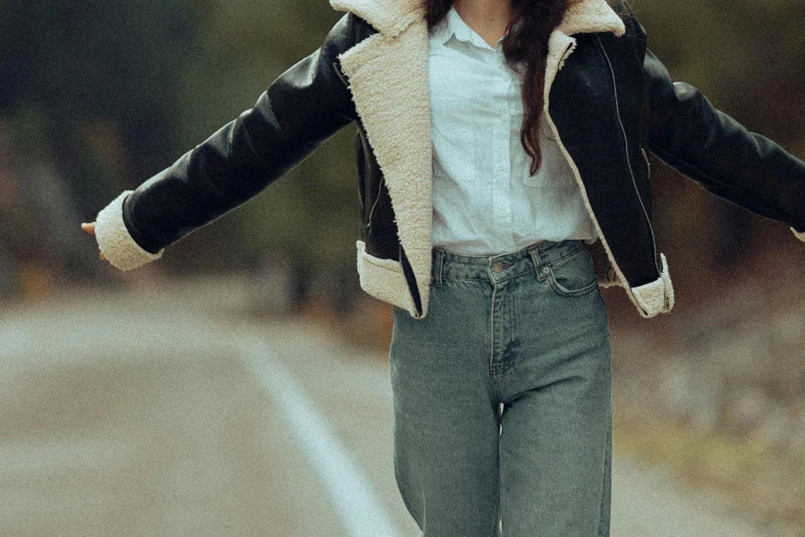 Person T-posing in a stylish winter leather jacket