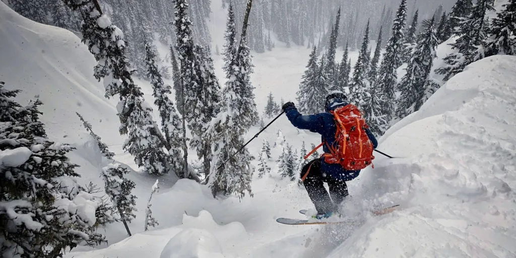 Person backcountry skiing with proper gear