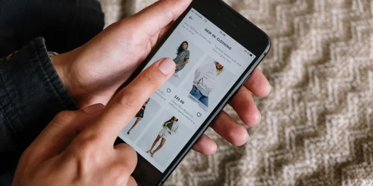 Person holding black iPhone 5