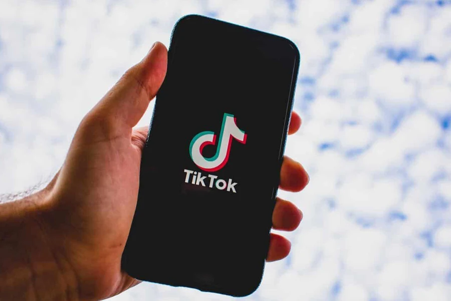 Person opening the Tik Tok app on a phone