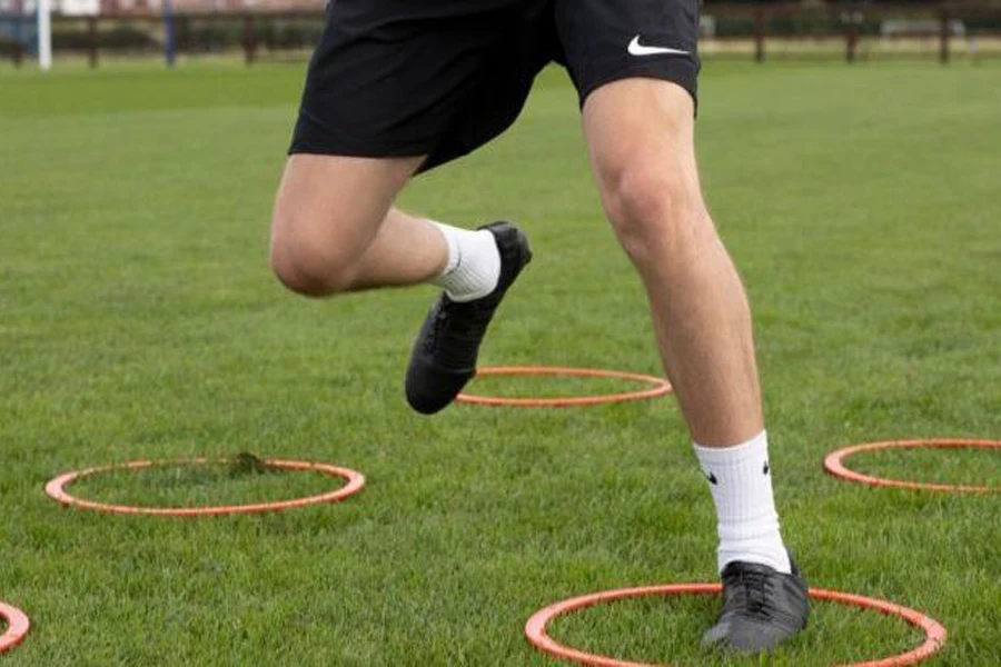 Person performing agility ring drills on a field