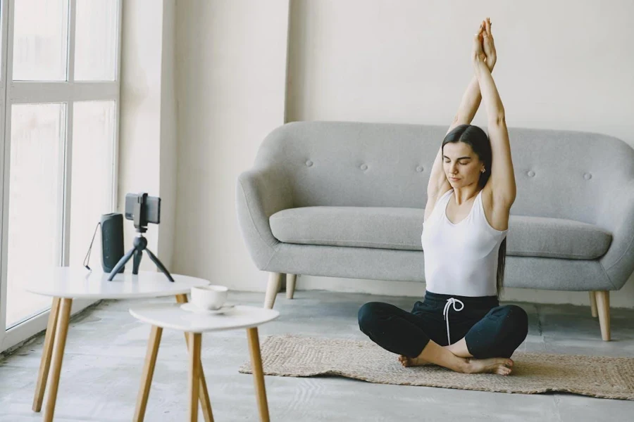 Person recording themselves doing yoga