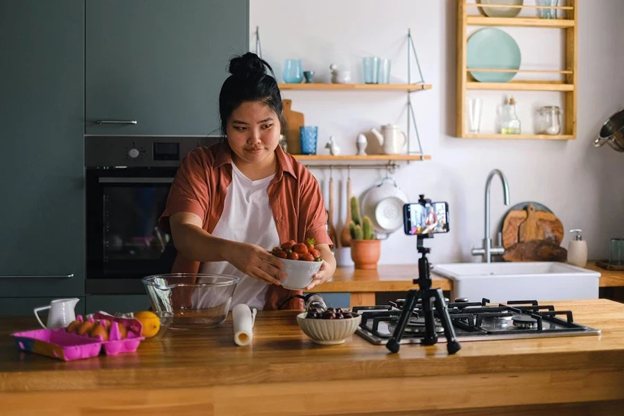 Person recording themselves in a kitchen