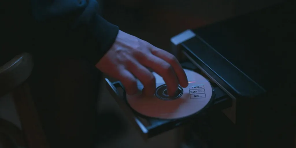 Person removing disc from optical drive