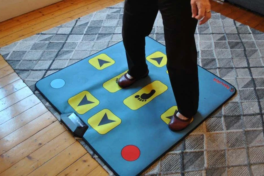 Person standing on a blue dance mat