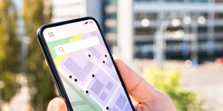 Person using a phone with map and place pointers