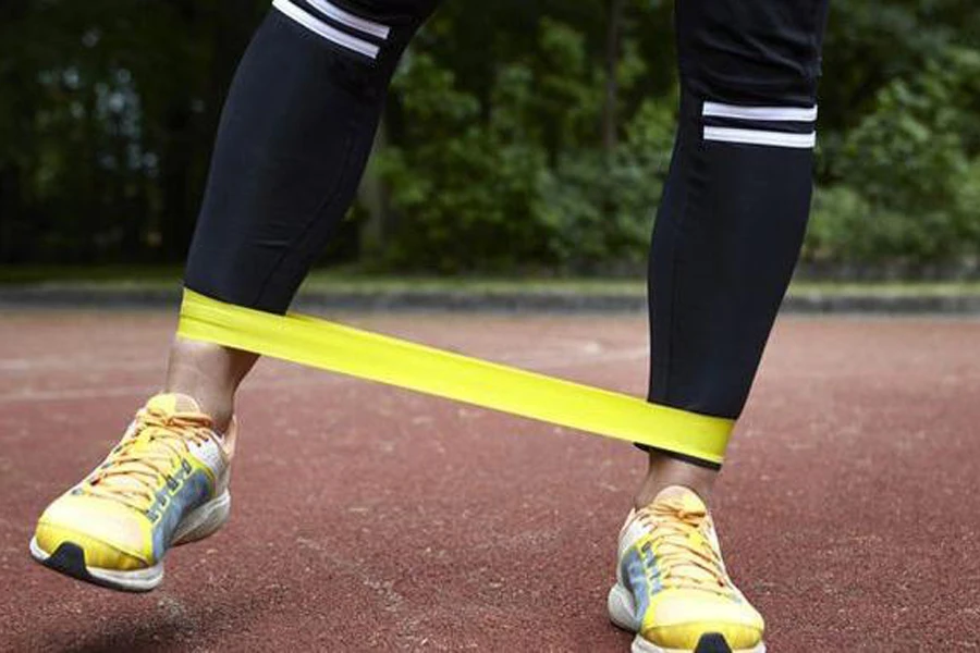 Person using a yellow resistance band