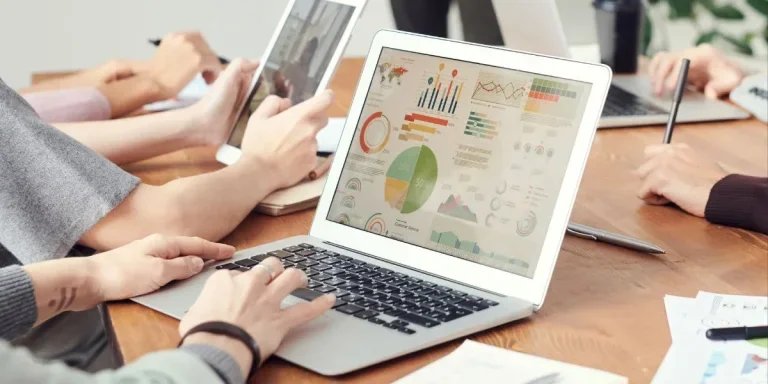 Person working on sales data on a laptop