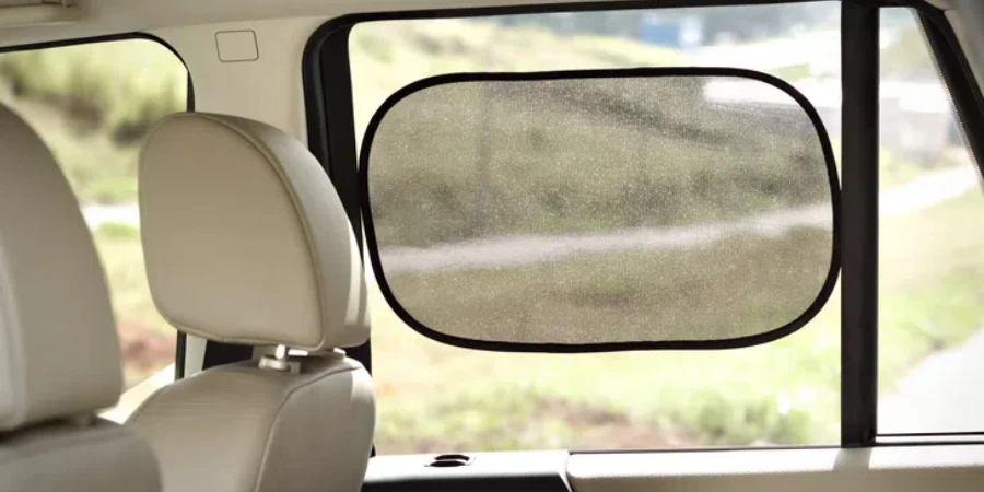 Rectangular black side window sun shade, on a car