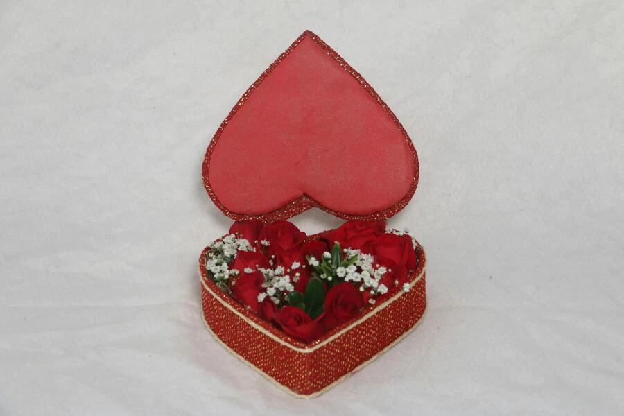 Red roses packed in a flower-shaped box