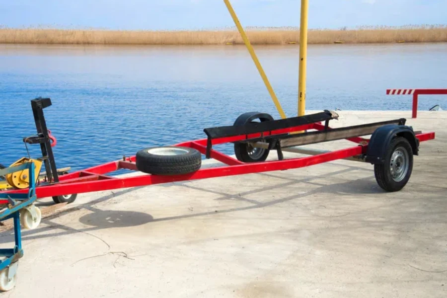 Red trailer to transport the boat on the river
