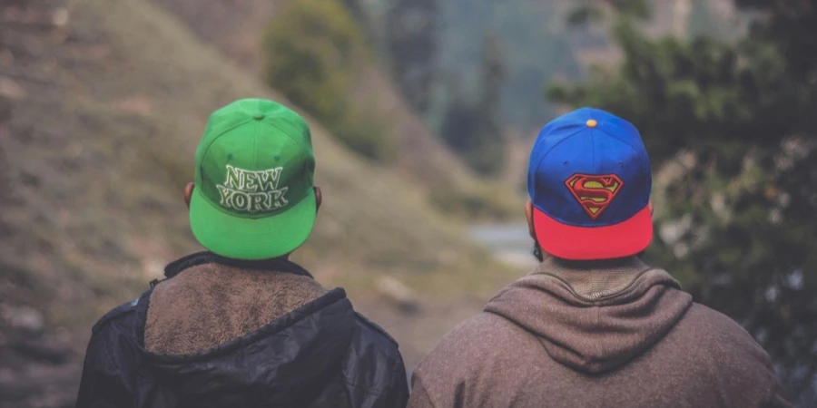 Shallow Focus Photography of Two Men Wearing Caps