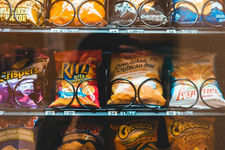 Shelves with assorted bright snack packages in machine