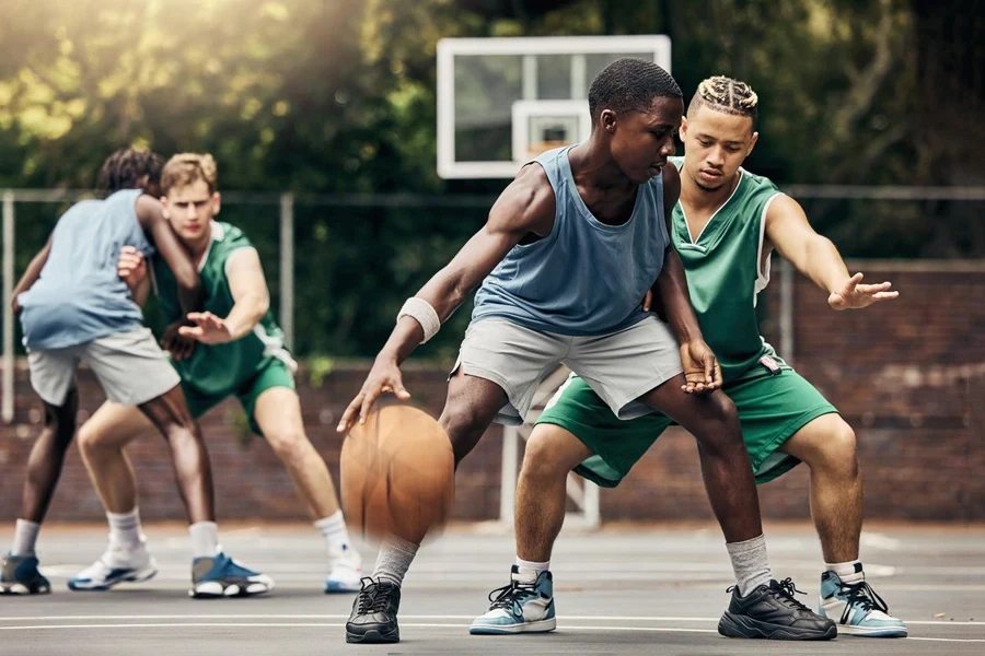 Sports, team and men playing basketball in a competition for college or university players with talent, skill and fitness