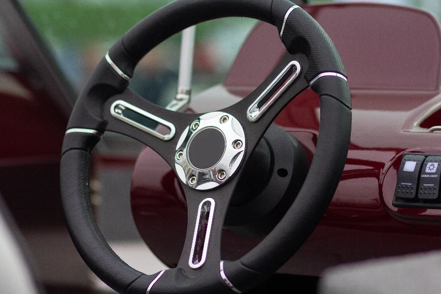 Steering wheel of a motor boat closeup