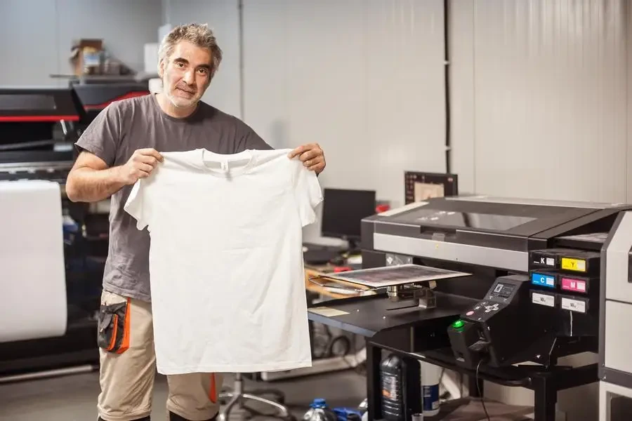 Technician showing empty t-shirt with blank space for insert print stock photo