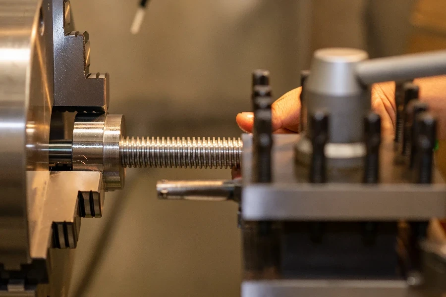 The operation of turning machine cutting the ball screw shaft part