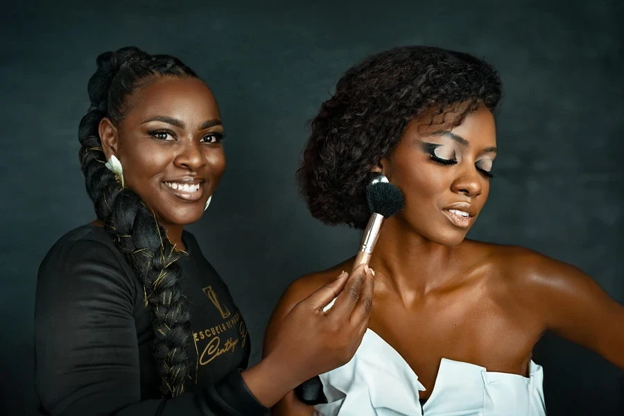 Two women are smiling and posing for the camera