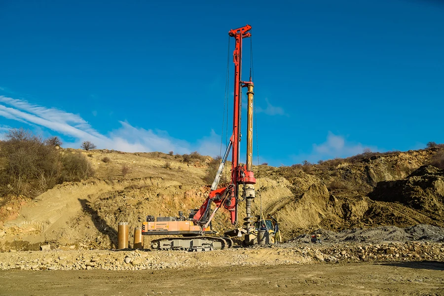 View of drilling machine at road works in the country in autumn