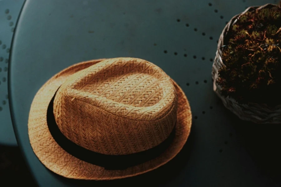 Wicker Straw Hat on Round Table