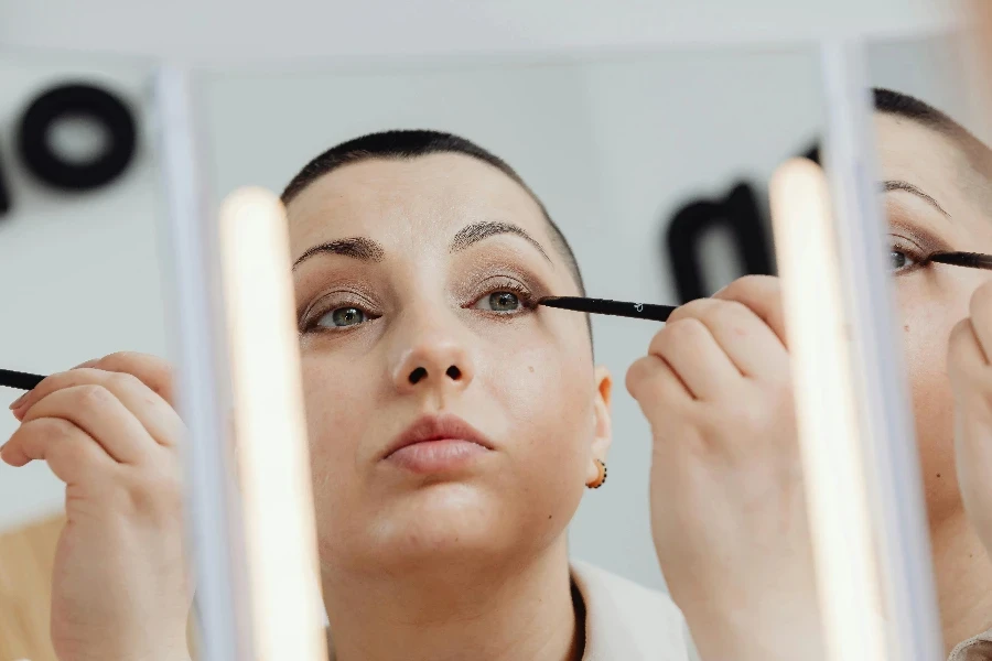 Woman Applying Eyeliner