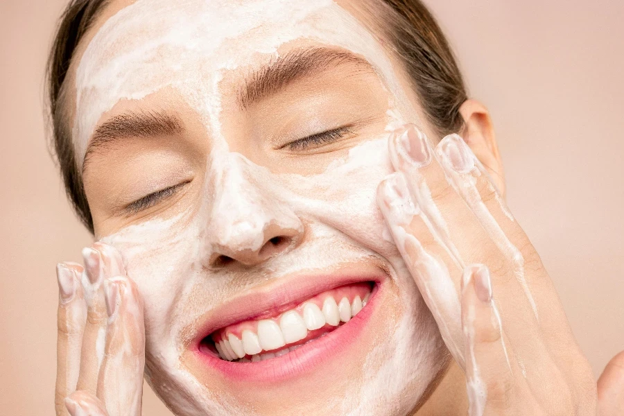 Woman With White Facial Soap on Face