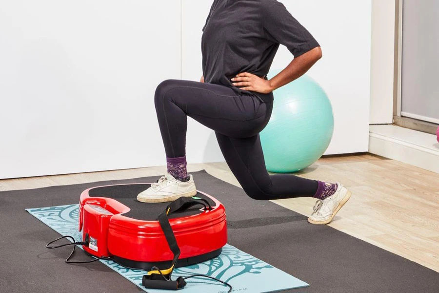 Woman exercising on a tri-planar vibration plate