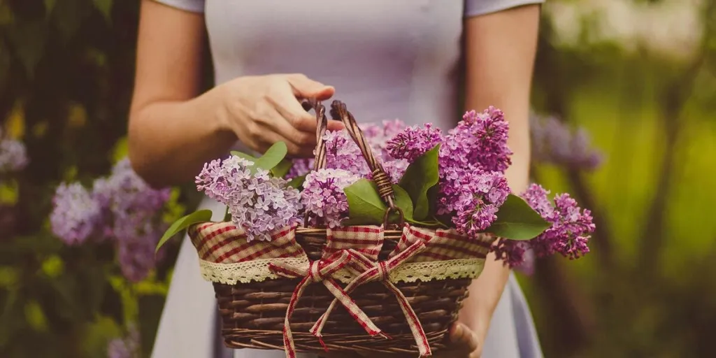 Woman holding flowers in a basket