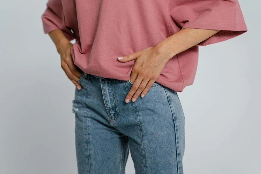 Woman in Pink Shirt and Blue Denim Jean